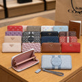 BILLETERA COACH PRADA
